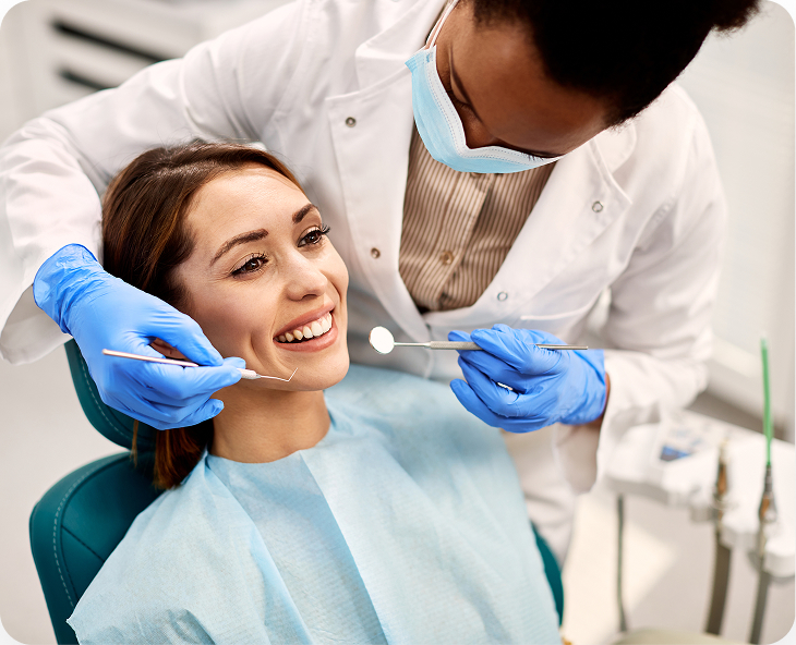 Dentist Examining Patient During Checkup
